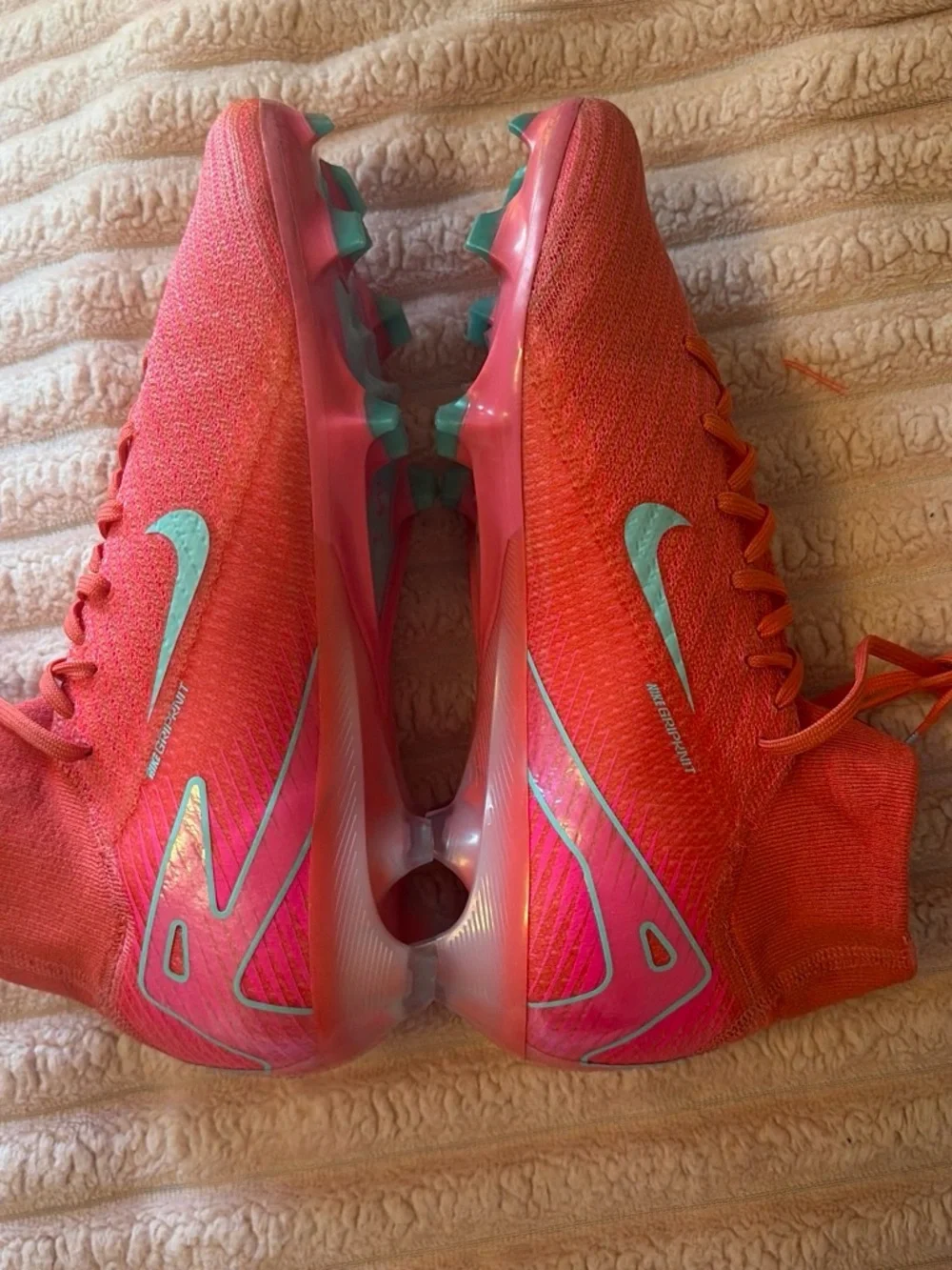 Nike Women's Pink Soccer Cleats with Teal Swoosh